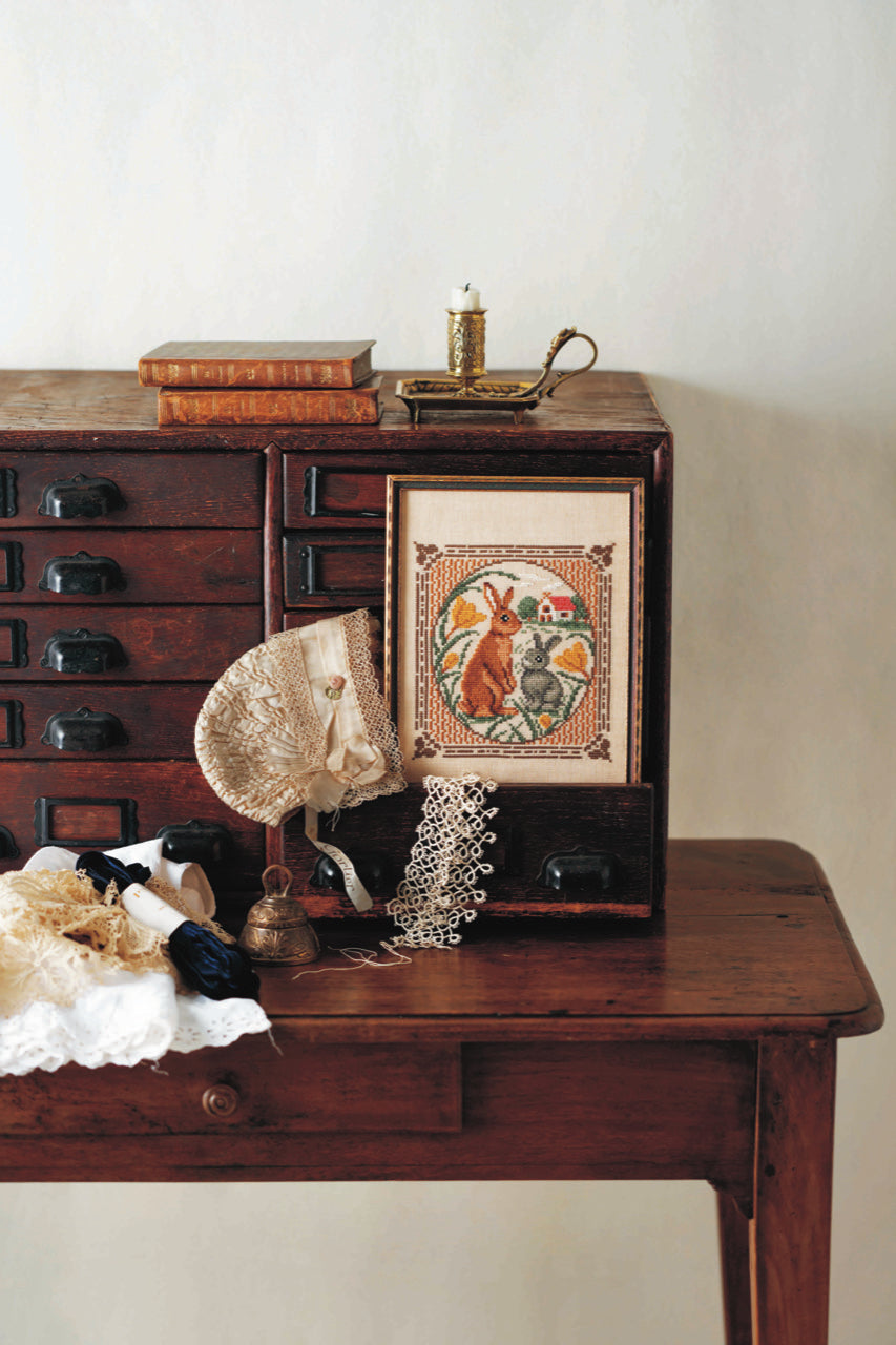 Style antique au point de croix