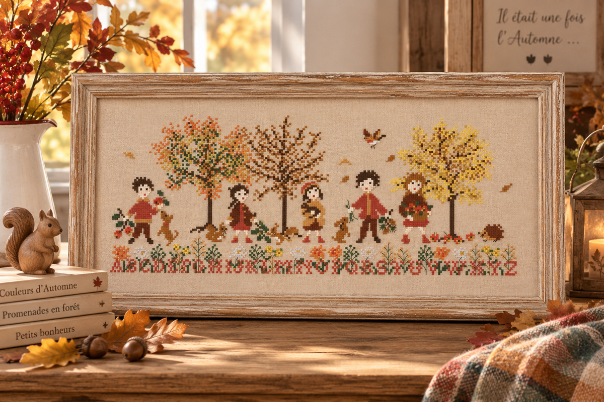 Brodez Les couleurs de l’automne de Perrette Samouïloff, une scène chaleureuse avec enfants, feuilles et petits animaux. Grille de point de croix de 209 × 83 points.