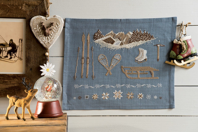 Mook point de croix : 20 créations de Jennifer Lantini autour de l’hiver — nature, maison et Noël — coussins, tableaux et hottes à broder avec douceur.
