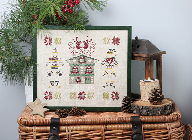 Mook point de croix : 20 créations de Jennifer Lantini autour de l’hiver — nature, maison et Noël — coussins, tableaux et hottes à broder avec douceur.