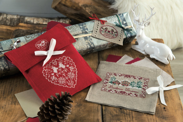 Mook point de croix : 20 créations de Jennifer Lantini autour de l’hiver — nature, maison et Noël — coussins, tableaux et hottes à broder avec douceur.