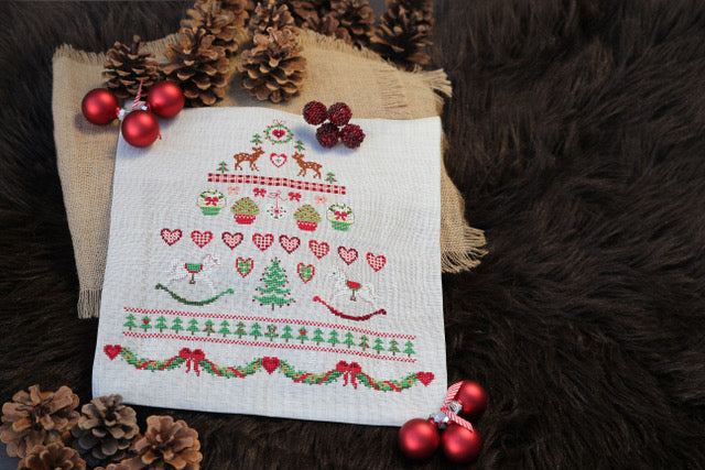 Mook point de croix : 20 créations de Jennifer Lantini autour de l’hiver — nature, maison et Noël — coussins, tableaux et hottes à broder avec douceur.